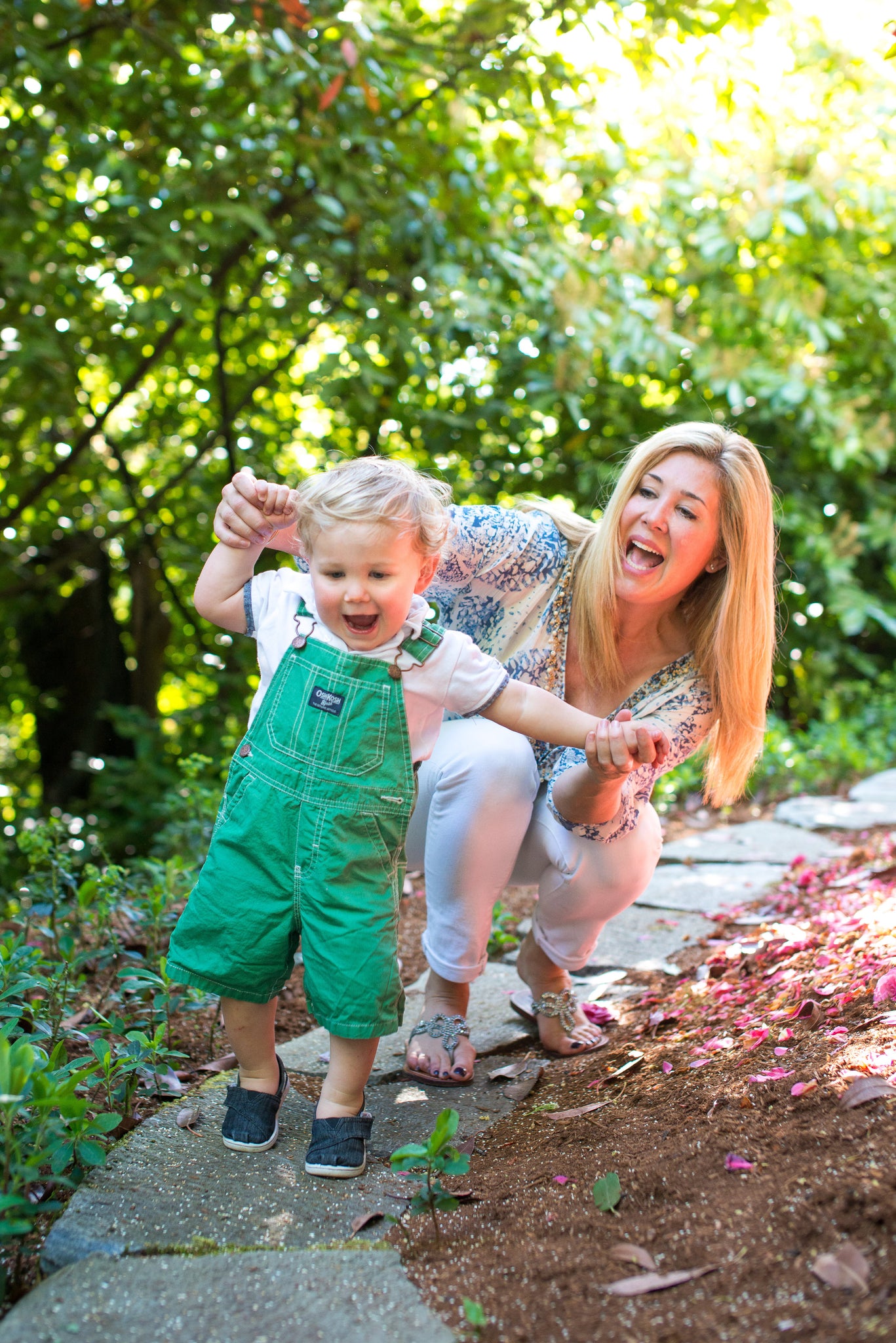 Joylux founder, Colette Courtion, with her son playing outside.